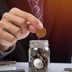 hand-putting-mix-coins-seed-clear-bottle-copyspace-business-investment-growth-concept hand-putting-mix-coins-seed-clear-bottle-copyspace-business-investment-growth-concept