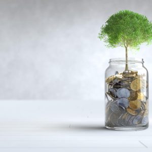 tree-grows-coin-glass-jar-with-copy-space